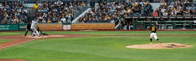 Baseball pitcher throwing toward a batter during a game, used as generic baseball statistics imagery
