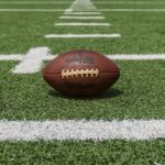 Generic American football on a field, used to illustrate NCAA college football divisions; not a specific game or team.