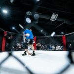 Two combat-sports athletes competing in a ring