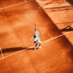 Generic men's tennis hard-court action, used as illustrative imagery and not as event photography.
