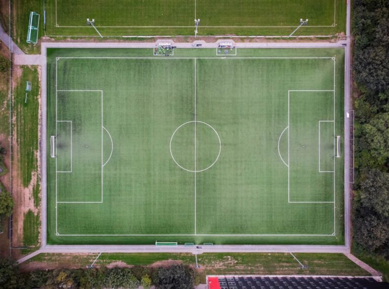 Generic soccer field used as illustrative soccer imagery; photo by Victor on Unsplash