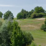 Generic golfer on a golf course, photo by John Apps via Unsplash