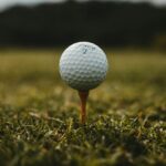 Golf ball on a green illustrating golf scoring and par