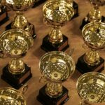 Collection of trophies illustrating championship concentration and sports dynasty criteria