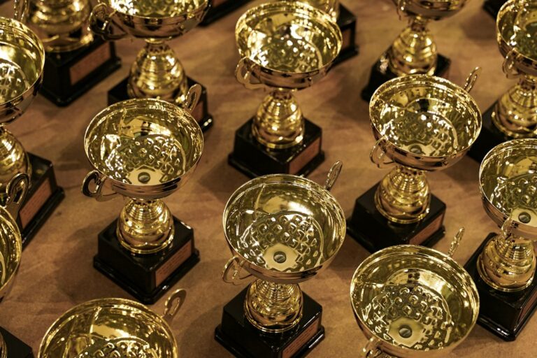 Collection of trophies illustrating championship concentration and sports dynasty criteria