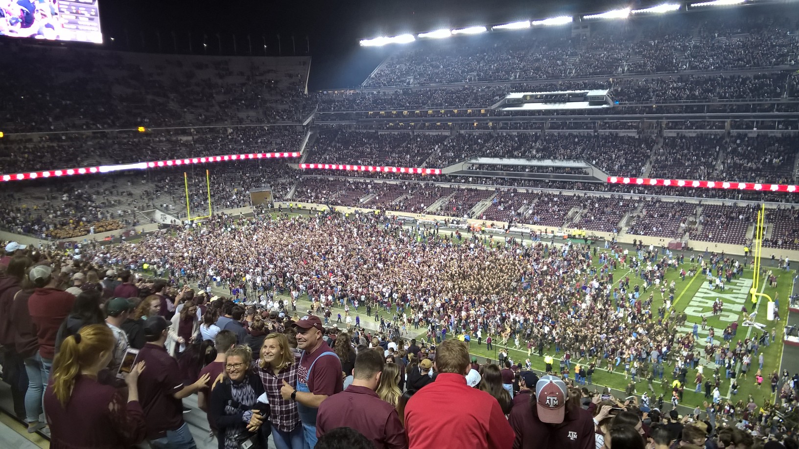 Texas A&M fans on the field at Kyle Field after a dramatic football win