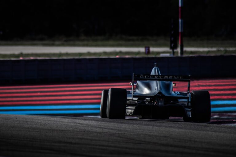 An open-wheel race car on a circuit used as generic Formula racing imagery
