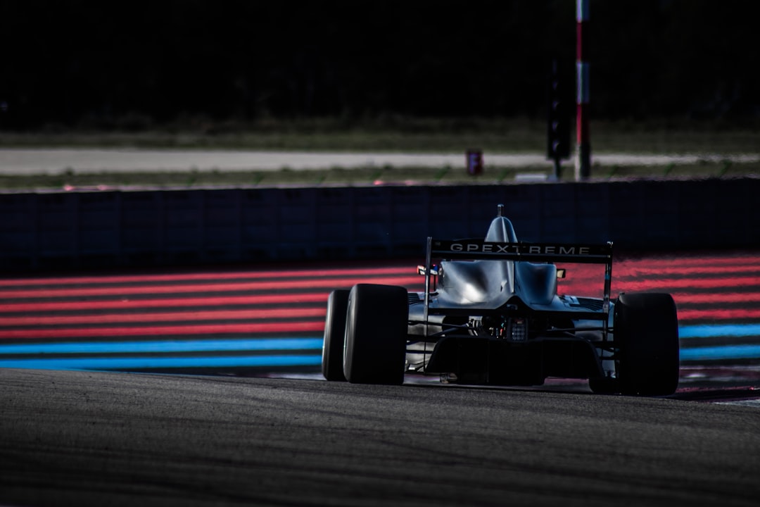 An open-wheel race car on a circuit used as generic Formula racing imagery