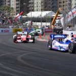 Open-wheel race cars on a street circuit used as generic IndyCar and Formula racing imagery