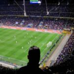 Crowded soccer stadium during a night match