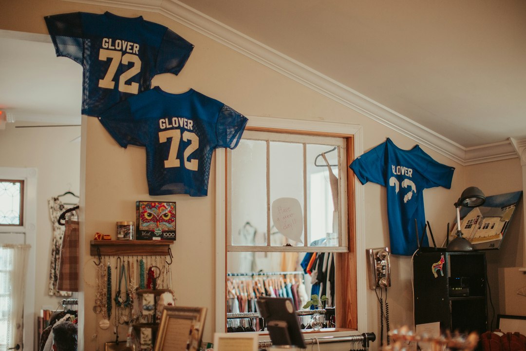 Football jersey displayed on a wall illustrating sports jersey framing and display planning