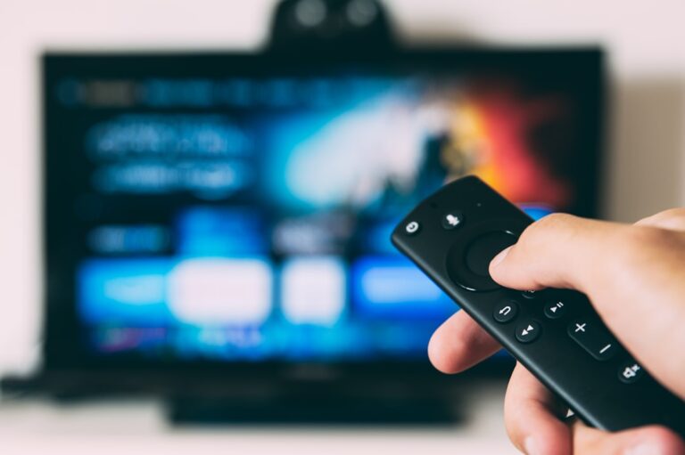 Generic television and streaming setup illustrating sports media rights across broadcast, cable, streaming, and FAST platforms.
