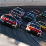Stock cars racing on a paved track, generic same-sport motorsports imagery for a NASCAR national series comparison