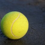 Generic tennis court and racket, photo by Ben Hershey via Unsplash