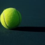 Generic tennis player on court, photo by Ben Hershey via Unsplash