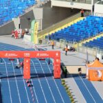 Finish line on a running track illustrating timing and record ratification conditions