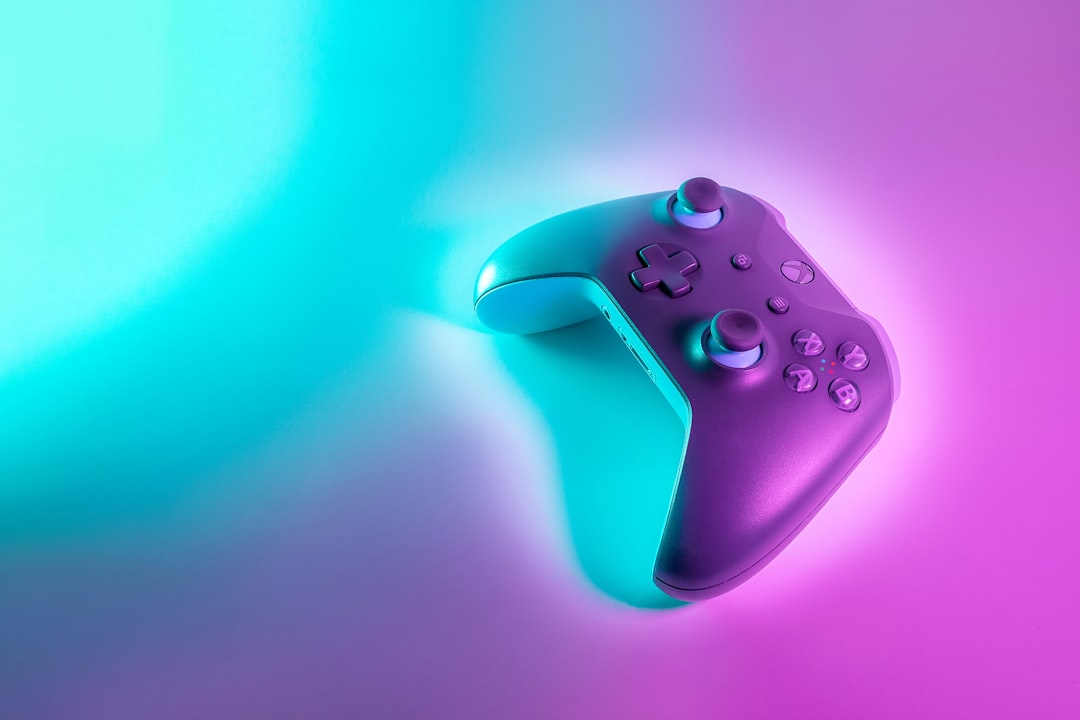 Wireless game controller illuminated in a gaming setup