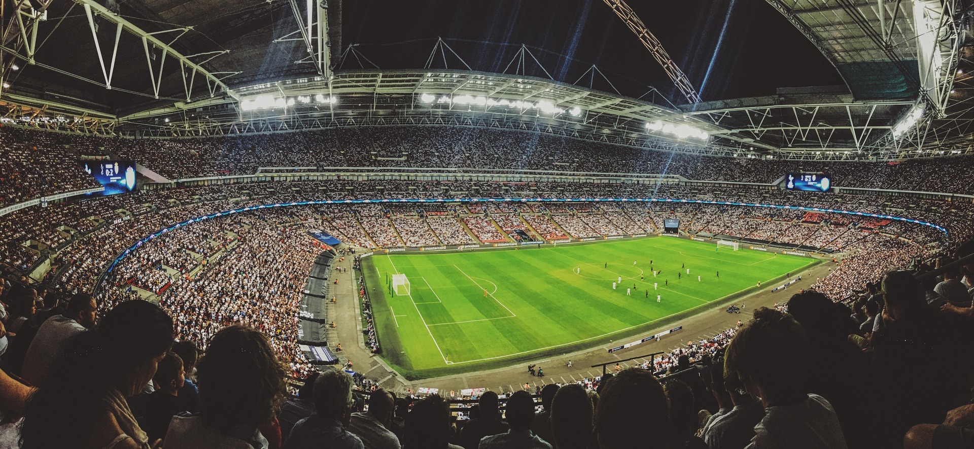 Sports fans gathered in a stadium crowd