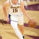 Austin Reaves driving in a Los Angeles Lakers game in 2023; archival exact-player image.