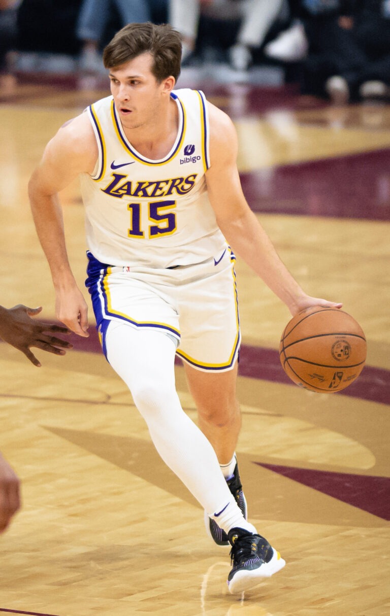 Austin Reaves driving in a Los Angeles Lakers game in 2023; archival exact-player image.